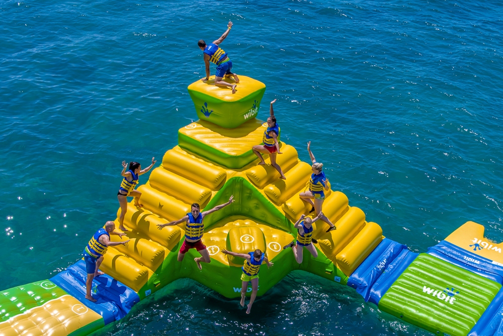 Resort guests may enjoy 100 feet of inflatable fun on the water with wild obstacle course challenges throughout this fun-filled attraction. Waterfront Beach and Aquapark at Horseshoe Bay Resort Debuts for Summer Thrills