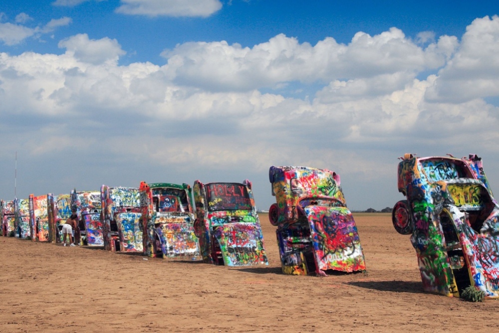 Visitors are welcome to participate in this always-open art installation and are encouraged to bring their own cans of spray paint to write graffiti. Cadillac Ranch